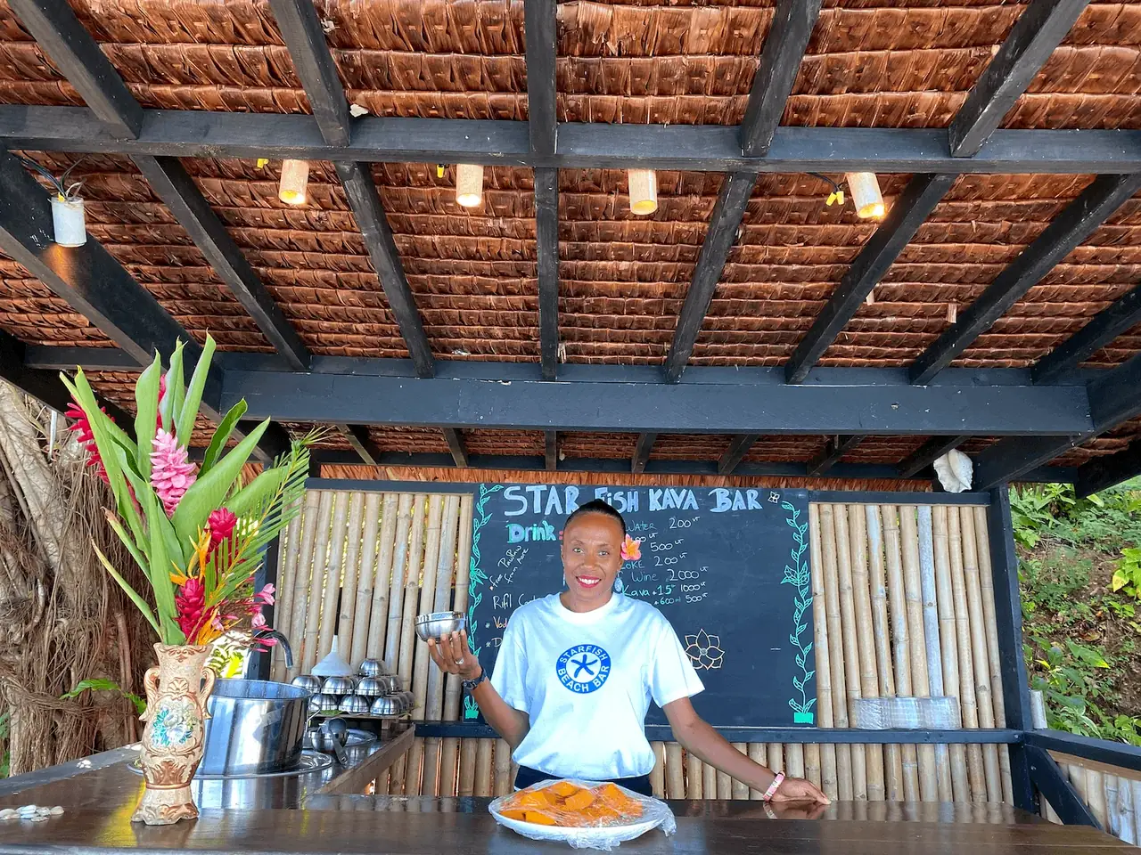 Starfish kava bar staff serving a shell of kava