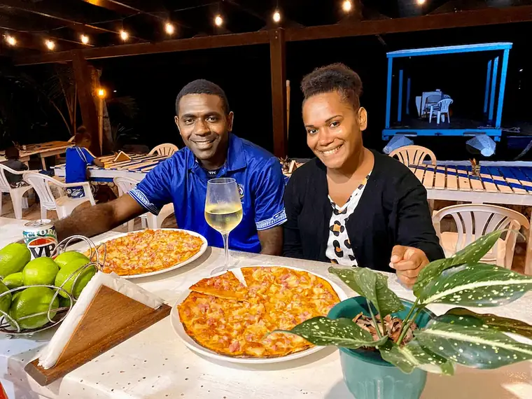 Guests enjoying pizzas